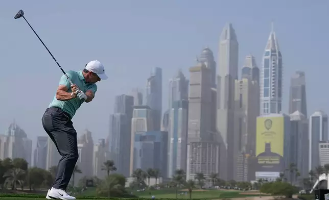 Rory McIlroy of Northern Ireland tees off at 8th hole during the final round of the Dubai Desert Classic in United Arab Emirates, Sunday, Jan. 25, 2026. (AP Photo/Altaf Qadri)