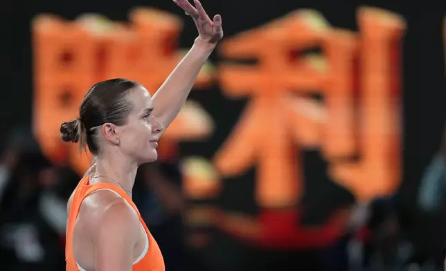 Elina Svitolina of Ukraine waves after defeating Coco Gauff of the U.S. in their quarterfinal match at the Australian Open tennis championship in Melbourne, Australia, Tuesday, Jan. 27, 2026. (AP Photo/Asanka Brendon Ratnayake)
