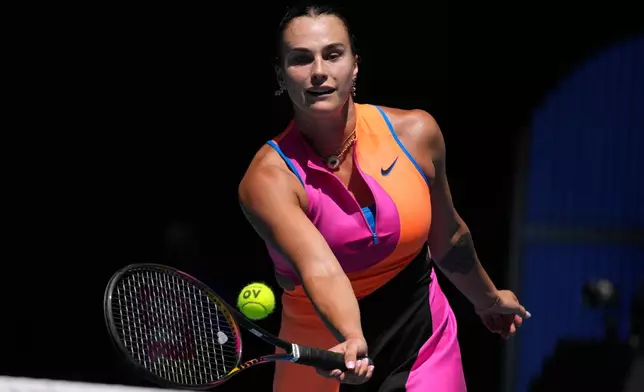 Aryna Sabalenka of Belarus plays a forehand return to Iva Jovic of the U.S. during their quarterfinal match at the Australian Open tennis championship in Melbourne, Australia, Tuesday, Jan. 27, 2026. (AP Photo/Dar Yasin)