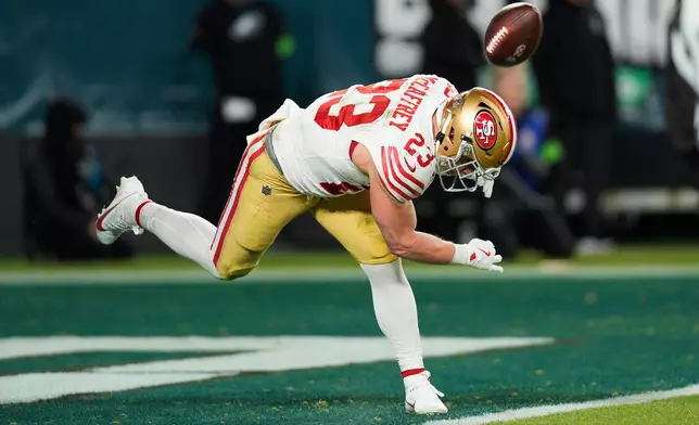 San Francisco 49ers running back Christian McCaffrey celebrates scoring a touchdown during the second half of an NFL wild-card playoff football game against the Philadelphia Eagles on Sunday, Jan. 11, 2026, in Philadelphia. (AP Photo/Chris Szagola)