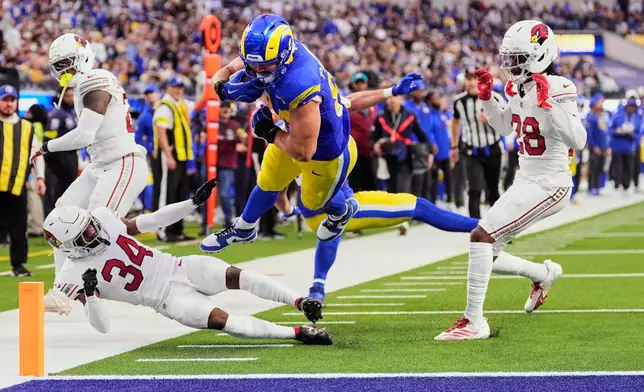 Los Angeles Rams tight end Colby Parkinson (84) dives into the end zone for a touchdown during the second half of an NFL football game against the Arizona Cardinals, Sunday, Jan. 4, 2026, in Inglewood, Calif. (AP Photo/Mark J. Terrill)