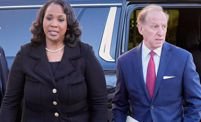 Federal Reserve governor Lisa Cook and attorney Abbe Lowell, arrive at the Supreme Court in Washington, Wednesday, Jan. 21, 2026. (AP Photo/Mark Schiefelbein)