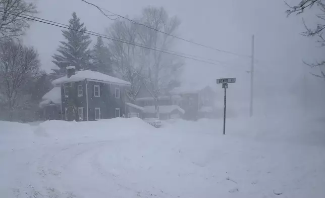 Strong winds kick up snow in Lowville, New York, on Friday, Jan. 23, 2026. (AP Photo/Cara Anna)
