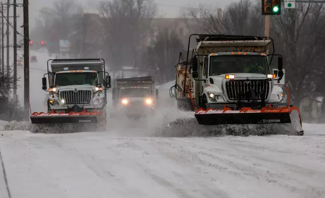 The streets are ployed during a winter storm Saturday, Jan. 24, 2026 in Tulsa, Okla. (Mike Simons/Tulsa World via AP)