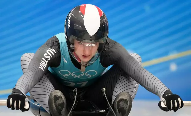 FILE - Madeleine Egle, of Austria, starts a luge women's singles training run at the 2022 Winter Olympics, on Feb. 5, 2022, in the Yanqing district of Beijing. (AP Photo/Dmitri Lovetsky, File)