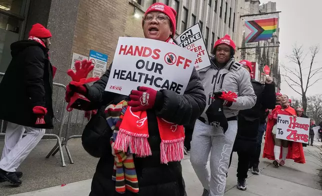 Striking nurses demonstrate outside Mt. Sinai Morningside Hospital, in New York, Wednesday, Jan. 14, 2026. (AP Photo/Richard Drew)