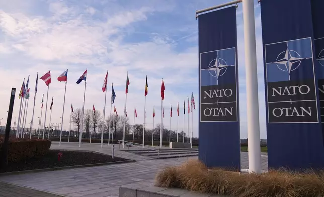 Flags flap in the wind outside NATO headquarters in Brussels, Monday, Jan. 19, 2026. (AP Photo/Virginia Mayo)