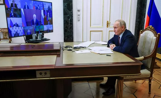 Russian President Vladimir Putin attends a cabinet meeting via videoconference at the Kremlin, in Moscow, Russia, Wednesday, Jan. 21, 2026. (Vyacheslav Prokofyev/Sputnik, Kremlin Pool Photo via AP)