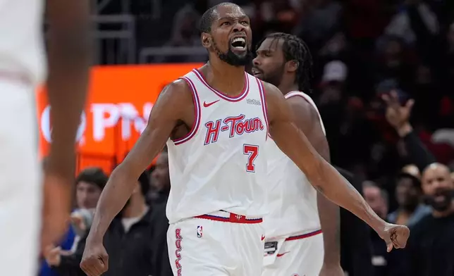 Houston Rockets forward Kevin Durant (7) reacts after scoring during the first half of an NBA basketball game against the San Antonio Spurs in Houston, Wednesday, Jan. 28, 2026. (AP Photo/Ashley Landis)