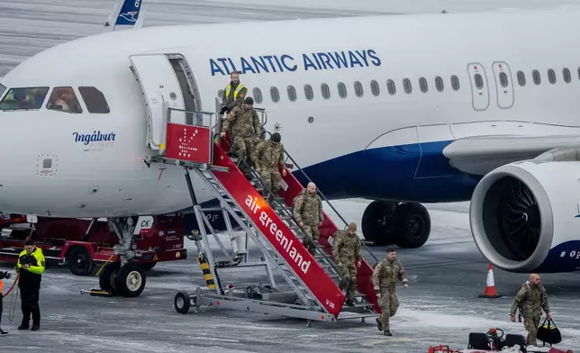 Danish soldiers land at Nuuk airport, Monday, Jan. 19, 2026. (Mads Claus Rasmussen/Ritzau Scanpix via AP)