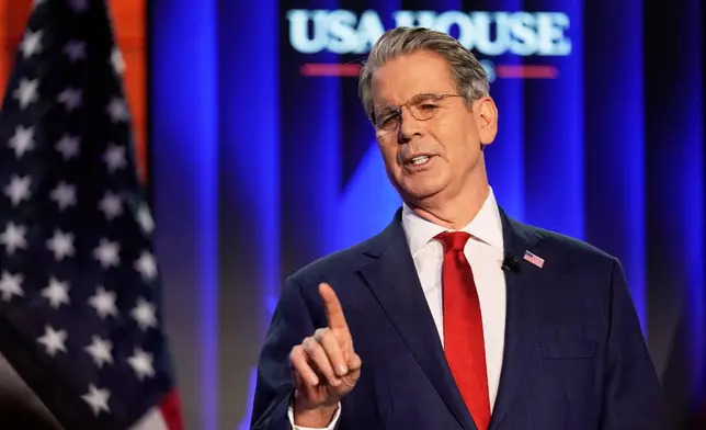 Scott Bessent, US Secretary of the Treasury, holds a speech at the USA House during the Annual Meeting of the World Economic Forum in Davos, Switzerland, Tuesday, Jan. 20, 2026. (AP Photo/Markus Schreiber)