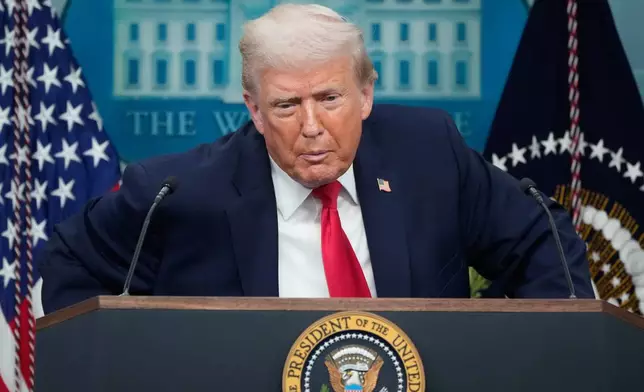 President Donald Trump listens to a question from a reporter during a press briefing at the White House in Washington, Tuesday, Jan. 20, 2026. (AP Photo/Mark Schiefelbein)