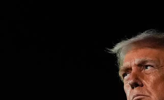 President Donald Trump speaks with reporters after arriving at Palm Beach International Airport, Monday, Jan. 19, 2026, in West Palm Beach, Fla. (AP Photo/Julia Demaree Nikhinson)