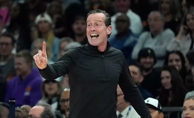 Cleveland Cavaliers head coach Kenny Atkinson argues with officials after getting a technical foul during the first half of an NBA basketball game against the Phoenix Suns Friday, Jan. 30, 2026, in Phoenix. (AP Photo/Ross D. Franklin)