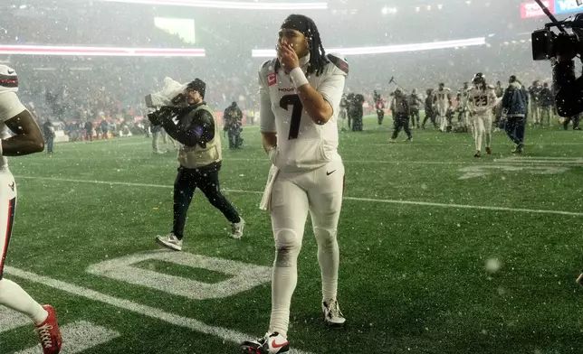 Houston Texans quarterback C.J. Stroud (7) walks off the field after an NFL divisional playoff football game against the New England Patriots, Sunday, Jan. 18, 2026, in Foxborough, Mass. (AP Photo/Robert F. Bukaty)