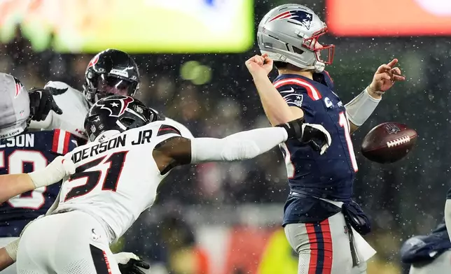 Houston Texans defensive end Will Anderson Jr. (51) sacks and forces New England Patriots quarterback Drake Maye to fumble, which the Texans recovered, during the second half of an NFL divisional playoff football game, Sunday, Jan. 18, 2026, in Foxborough, Mass. (AP Photo/Robert F. Bukaty)