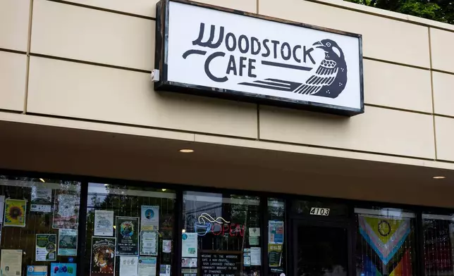 A sign for Woodstock Cafe is seen on May 15, 2025, in Portland, Ore. (Allison Barr/The Oregonian via AP)