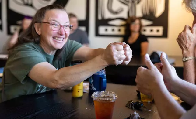 People attend a weekly meet up called "Sign Squad" at the Woodstock Cafe on June 10, 2025, in Portland, Ore. (Allison Barr/The Oregonian via AP)
