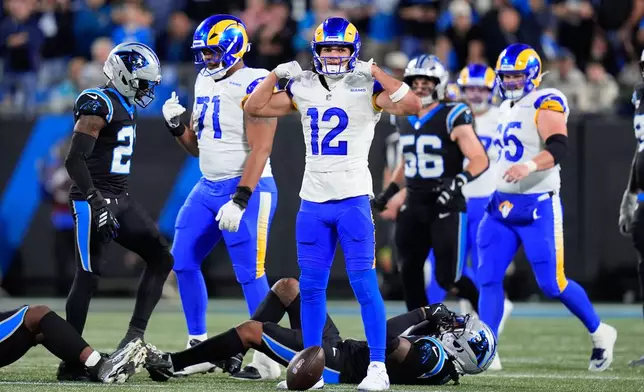 Los Angeles Rams wide receiver Puka Nacua (12) reacts after a first down during the second half of an NFL wild-card playoff football game against the Carolina Panthers, Saturday, Jan. 10, 2026, in Charlotte, N.C. (AP Photo/Erik Verduzco)