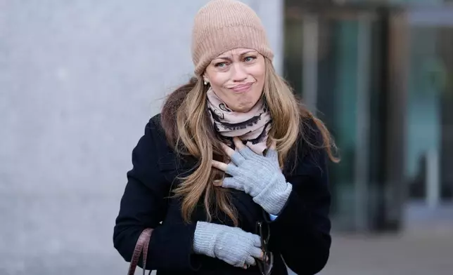 Drew Dixon talks to a fan before entering the courthouse in New York, Monday, Jan. 12, 2026. (AP Photo/Seth Wenig)