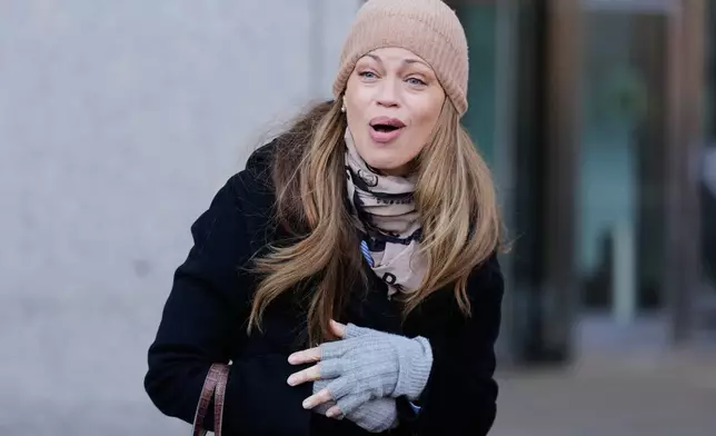 Drew Dixon talks to a fan before entering the courthouse in New York, Monday, Jan. 12, 2026. (AP Photo/Seth Wenig)