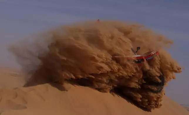 Driver Simon Vitse and co-driver Max Delfino compete during the sixth stage of the Dakar Rally between Hail and Riyadh, Saudi Arabia, Friday, Jan. 9, 2026. (AP Photo/Thibault Camus)