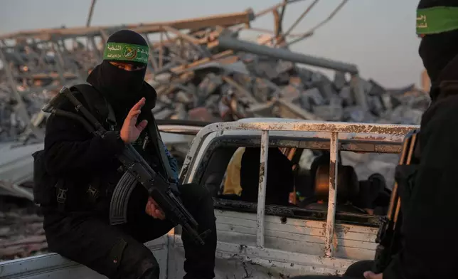 Hamas militants search for the remains of Israeli hostage in Zeitoun neighborhood of Gaza City, Wednesday, Jan. 7, 2026. (AP Photo/Abdel Kareem Hana)