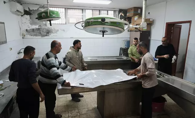 The body of 11-year-old Palestinian girl Hamsa Hosou, killed by Israeli fire in Jabalia, is brought to Shifa Hospital in Gaza City Thursday, Jan. 8, 2026. (AP Photo/Jehad Alshrafi)