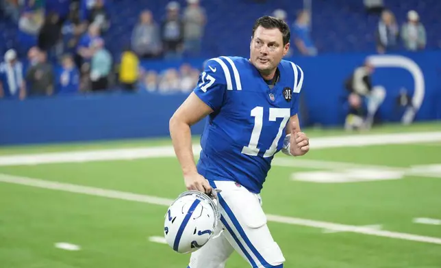 Indianapolis Colts quarterback Philip Rivers jogs off the field following an NFL football game against the Jacksonville Jaguars Sunday, Dec. 28, 2025, in Indianapolis. (AP Photo/AJ Mast)