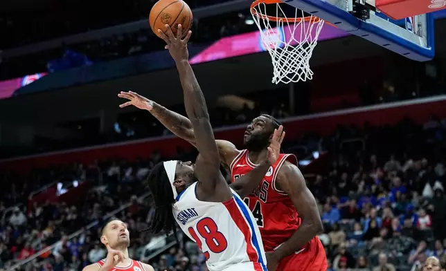 Detroit Pistons forward Isaiah Stewart, left, shoots against Chicago Bulls forward Patrick Williams during the first half of an NBA basketball game Wednesday, Jan. 7, 2026, in Detroit. (AP Photo/Ryan Sun)