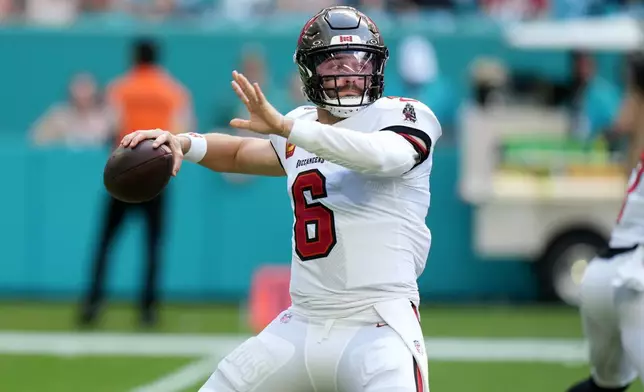 Tampa Bay Buccaneers quarterback Baker Mayfield looks to pass against the Miami Dolphins during the first half of an NFL football game Sunday, Dec. 28, 2025, in Miami Gardens, Fla. (AP Photo/Lynne Sladky)
