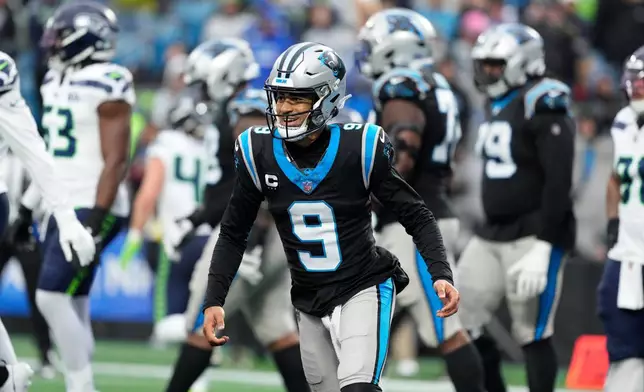 Carolina Panthers quarterback Bryce Young celebrates after scoring against the Seattle Seahawks during the second half of an NFL football game, Sunday, Dec. 28, 2025, in Charlotte, N.C. (AP Photo/Jacob Kupferman)