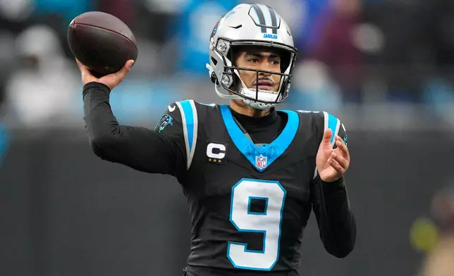 Carolina Panthers quarterback Bryce Young passes against the Seattle Seahawks during the second half of an NFL football game, Sunday, Dec. 28, 2025, in Charlotte, N.C. (AP Photo/Jacob Kupferman)