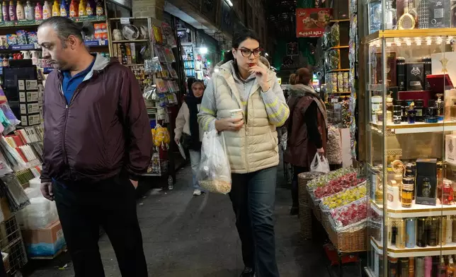 People walk at Tajrish traditional bazaar in northern Tehran, Iran, Tuesday, Jan. 27, 2026. (AP Photo/Vahid Salemi)