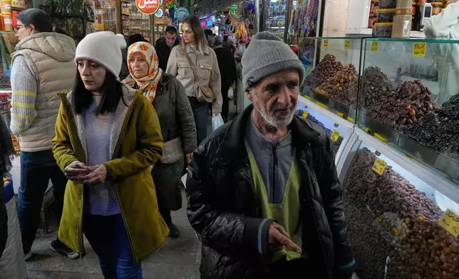 People walk at Tajrish traditional bazaar in northern Tehran, Iran, Tuesday, Jan. 27, 2026. (AP Photo/Vahid Salemi)