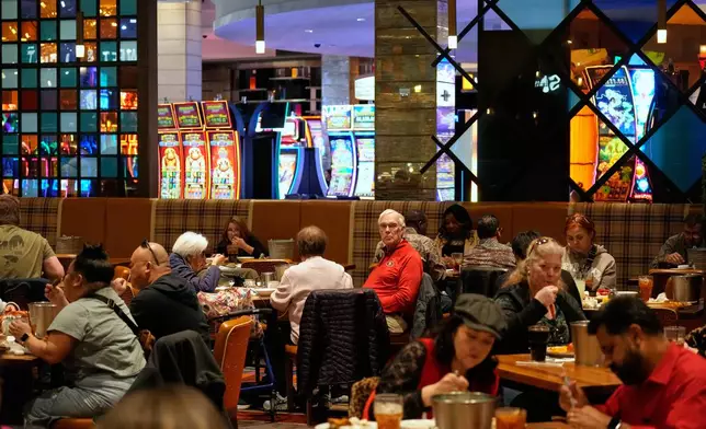 People eat at the A.Y.C.E Buffet in the Palms resort-casino Wednesday, Jan. 28, 2026, in Las Vegas. (AP Photo/John Locher)