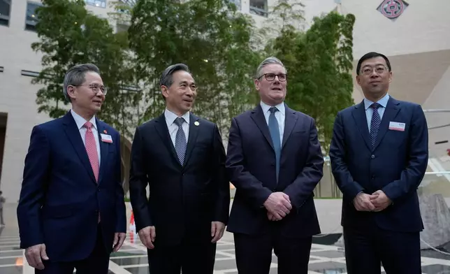 From left, Zheng Zeguang, Chinese ambassador to to Britain, Ren Hongbin, Chairman of the China Council for the Promotion of International Trade (CCPIT), Britain's Prime Minister Keir Starmer and Ge Haijiao, Chairman and Executive Director of the Bank of China Limited (BOC) pose for photos in Beijing, China, Friday, Jan. 30, 2026. (AP Photo/Kin Cheung, Pool)