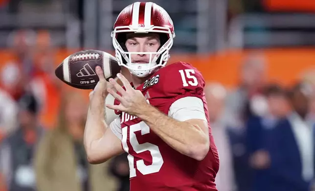 Indiana quarterback Fernando Mendoza passes against Miami during the first half of the College Football Playoff national championship game, Monday, Jan. 19, 2026, in Miami Gardens, Fla. (AP Photo/Rebecca Blackwell)