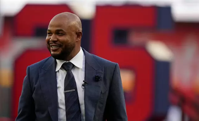 FILE - Former Atlanta Braves player Andruw Jones walks on the field as his number is retired Sept. 9, 2023, in Atlanta. (AP Photo/Brynn Anderson, File)