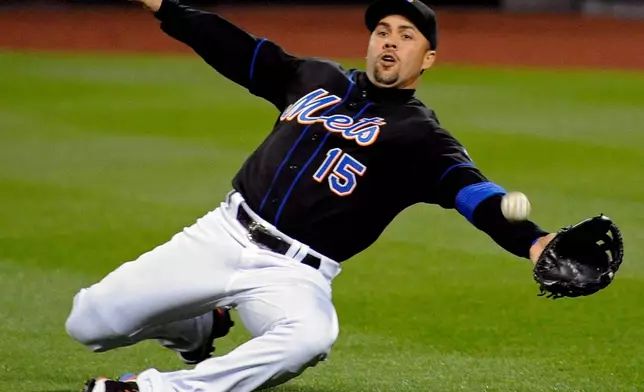 FILE - New York Mets right fielder Carlos Beltran lunges for the ball during the third inning of an MLB baseball game against the Arizona Diamondbacks, April 22, 2011 in New York. (AP Photo/Bill Kostroun, File)