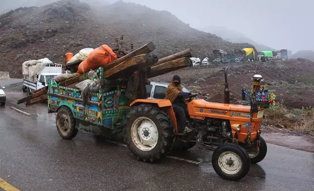 Vehicles loaded with belongings of families who fled from Tirah, a town in the Khyber Pakhtunkhwa province, amid uncertainty over a military operation against the Pakistani Taliban, travel to a registration center in Bara, a town of Pakistan's northwestern Khyber district, Tuesday, Jan. 27, 2026. (AP Photo/Muhammad Sajjad)