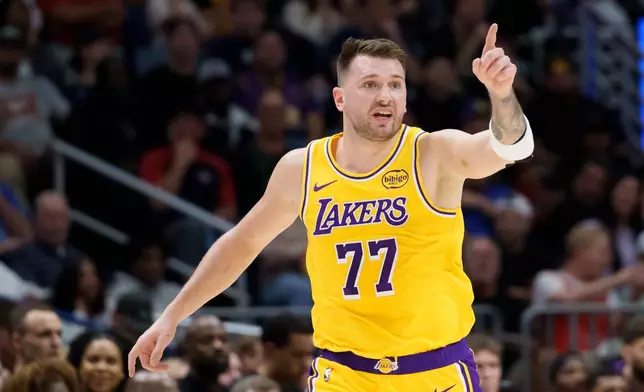 Los Angeles Lakers forward/guard Luka Dončić (77) reacts during the first half of an NBA basketball game against the New Orleans Pelicans in New Orleans, Tuesday, Jan. 6, 2026. (AP Photo/Matthew Hinton)