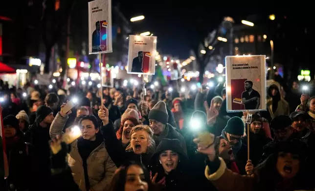 People take part in a rally in support of anti-government protests in Iran, Berlin Germany, Wednesday, June 14, 2026. (AP Photo/Ebrahim Noroozi)