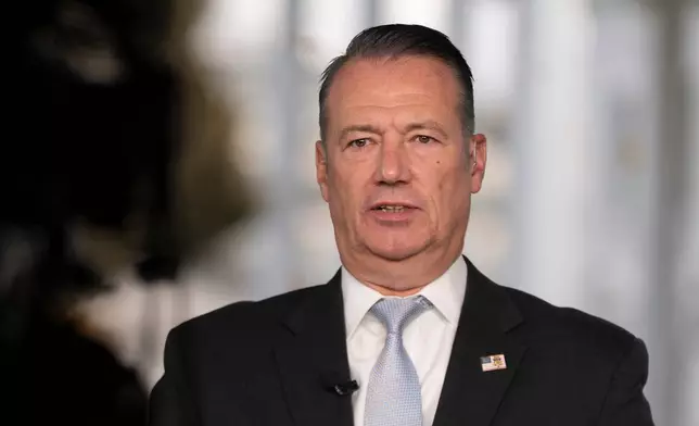 FILE - Todd Lyons, acting director of the U.S. Immigration and Customs. Enforcement (ICE), is interviewed on TV on the White House grounds, Monday, Nov. 3, 2025 in Washington. (AP Photo/Manuel Balce Ceneta, File)