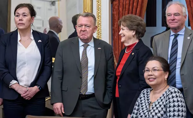 From left, Greenland Foreign Minister Vivian Motzfeldt, Danish and Foreign Minister Lars Løkke Rasmussen, stand with members of the Senate Foreign Relations Committee, Sen. Jeanne Shaheen, D-N.H., Sen. Tammy Duckworth, D-Ill., and Sen. Tim Kaine, D-Va., amid President Donald Trump's ambitions to take control of Greenland, a semiautonomous territory of Denmark, during a meeting at the Capitol in Washington, Thursday, Jan. 15, 2026. (AP Photo/J. Scott Applewhite)