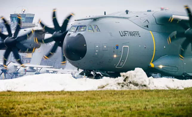 An Airbus A400M transport aircraft of the German Air Force taxis over the grounds at Wunstorf Air Base in the Hanover region, Germany, Thursday, Jan. 15, 2026 as troops from NATO countries, including France and Germany, are arriving in Greenland to boost security. (Moritz Frankenberg/dpa via AP)