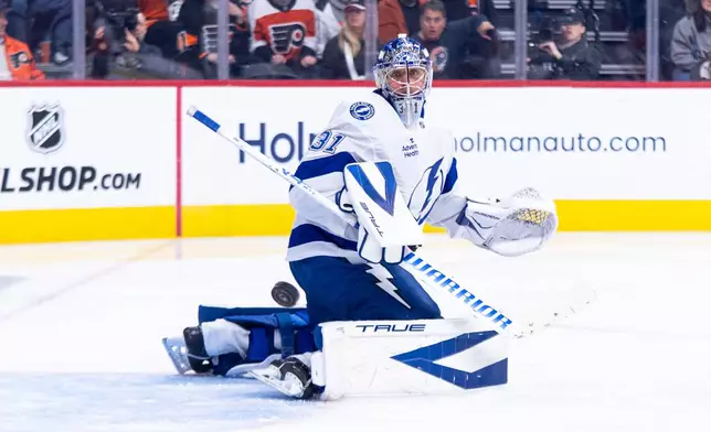 Tampa Bay Lightning's Jonas Johansson makes the save during the second period of an NHL hockey game against the Philadelphia Flyers, Monday, Jan. 12, 2026, in Philadelphia. (AP Photo/Chris Szagola)