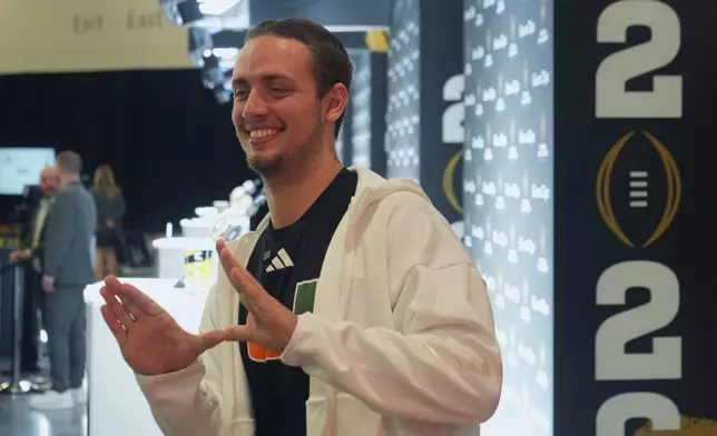 Miami quarterback Carson Beck poses during media day ahead of the College Football Playoff national championship game between Miami and Indiana, Sunday, Jan. 17, 2027, in Miami. The game will be played on Monday. (AP Photo/Marta Lavandier)