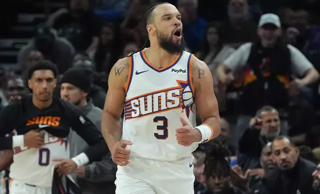Phoenix Suns forward Dillon Brooks celebrates a made 3-pointer against the Detroit Pistons during the first half of an NBA basketball game Thursday, Jan. 29, 2026, in Phoenix. (AP Photo/Ross D. Franklin)