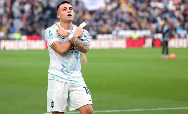 Inter Milan's Lautaro Martinez celebrates after scoring his side's opening goal, during the Serie A soccer match between Udinese and Inter, in Udine, Italy, Saturday, Jan. 17, 2026. (Andrea Bressanutti/LaPresse via AP)